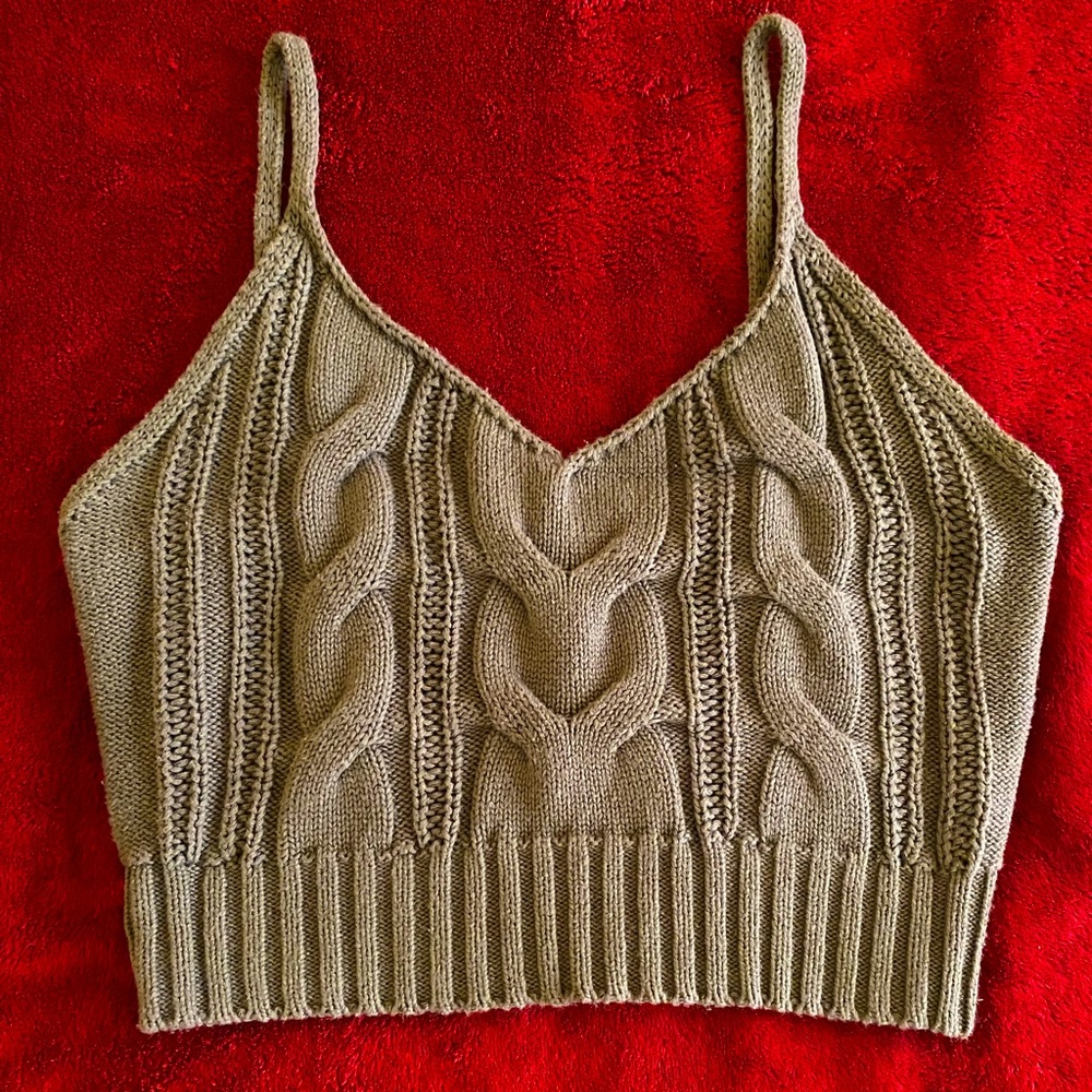 Cute stitched styled green top in the size small & has only been wore twice.